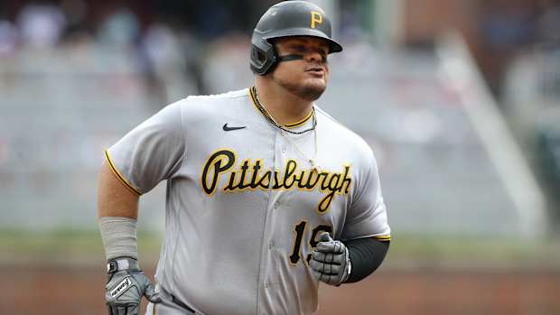 Pirates designated hitter Daniel Vogelbach rounds the bases after hitting a home run.